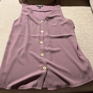 Light purple sleeveless blouse with gold buttons